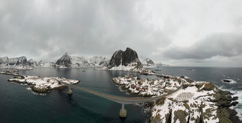 Aerial point of view of Lofoten.  Drone panorama landscape of Reine and Hamnoy fishing villages with fjords and mountains in the background in Norway. Top view of Lofoten Islands winter scenery.