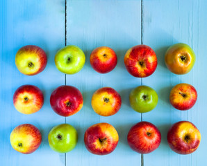 Food background. Apples on blue wooden background. 