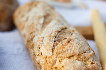 Closeup fresh baked bread on light blurred background
