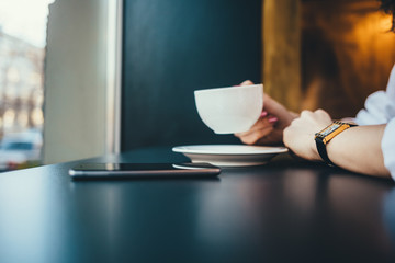 Stylish businesswoman drinking coffee