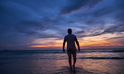 Man watching sunset on the beach