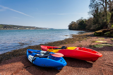 Two Canoes sitting on the estuary side ready for a day out on the water