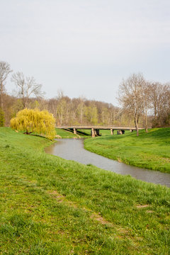 Picture of river Luppe with historic railway viaduct in Leipzig. This is a beautiful place for tourists. This is a wonderful opportunity for cyclists, skateboarders and pedestrians