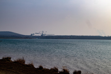 View from lake Markkleeberger lake with passenger ship and modern residential houses