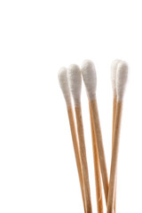 Eco-friendly materials. Wooden, cotton swabs on a white background.