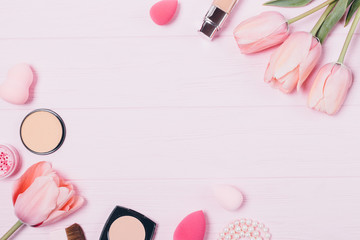 Beauty products and fresh tulip flowers