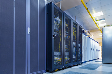 Server internet datacenter room with rows of modern mainframes. Server control center for internet...