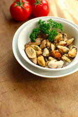 mussels A serving of seafood is a white plate. food background. top image