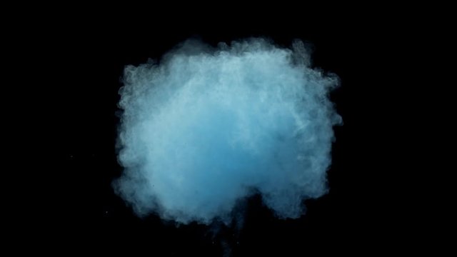 Super slowmotion shot of blue powder explosion isolated on black background.