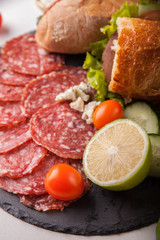 cold meat dish and sandwiches