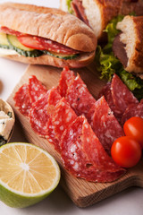 cold meat dish and sandwiches