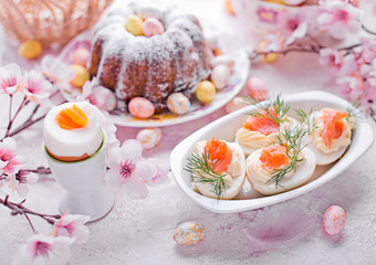 Easter breakfast.Cake and eggs with salmon