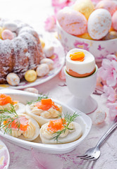 Easter breakfast.Cake and eggs with salmon