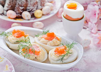 Easter breakfast.Cake and eggs with salmon