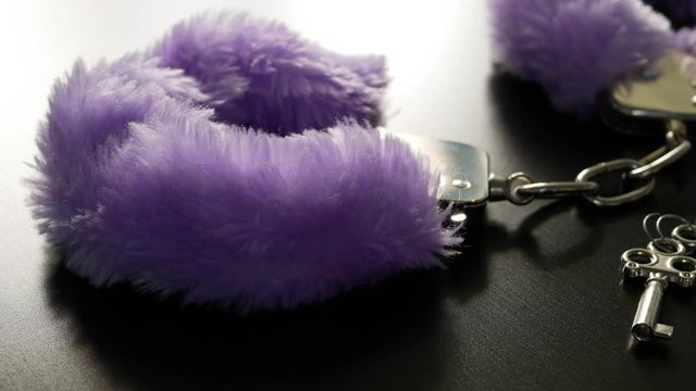 Purple handcuff with key, slider shot