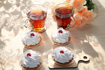 A cup of tea and a cake on a sunny table, a bouquet of spring flowers for mood, diet food and a healthy lifestyle in the village, a beautiful morning in the village, a delicious dessert