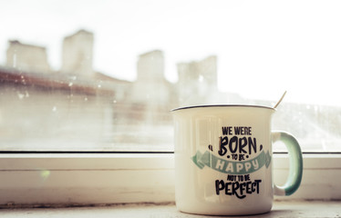 Mug of tea with words 