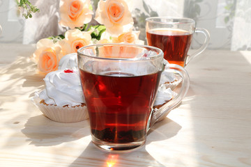 A cup of tea and a cake on a sunny table, a bouquet of spring flowers for mood, diet food and a healthy lifestyle in the village, a beautiful morning in the village, a delicious dessert