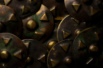 Vintage metal buttons. Old decorative metal design elements background.