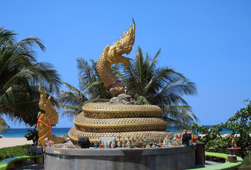 11 February 2019, Phuket, Karon beach, Thailand. Figurines of people, animals, Buddha figures and a large figure of a snake.