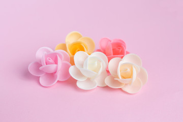 Waffle flowers on a pink background. Confectionery decor. The large plan. Macro.