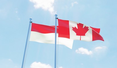 Canada and Indonesia, two flags waving against blue sky. 3d image