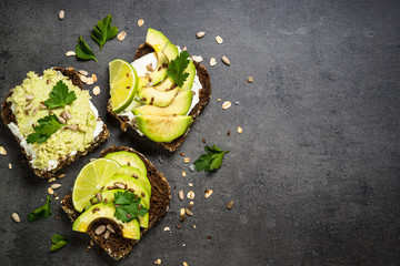 Sandwiches with avocado on black.