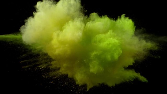 Super slowmotion shot of color powder explosion isolated on black background.