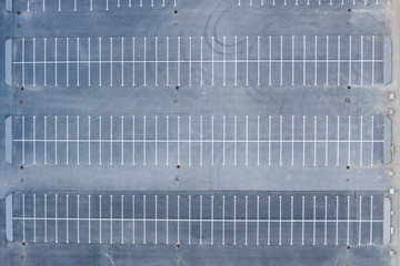 Top aerial view of parking to a large area empty asphalt car parking. © aapsky