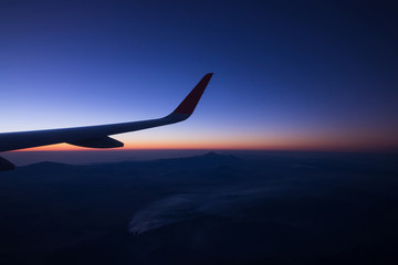 Sunrise on window plane wiew, with mountains on the background in the region of Cancun
