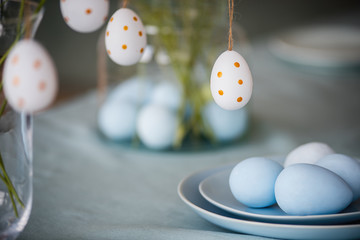 Happy Easter. Easter holidays. On the table in the plate are Easter eggs.