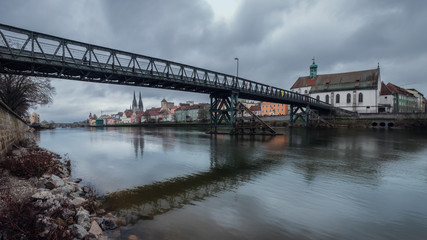 Panorama view from Danube on the bridge Eiserner Steg Regensburg and old town