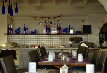 View into open space restaurant with set tables..