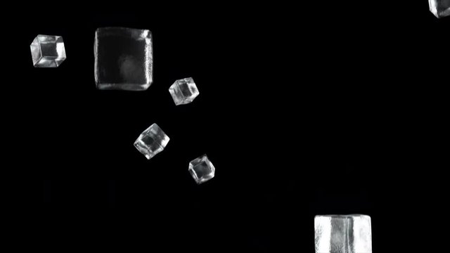 Ice cubes falling on isolated black background. Seamless loop 4k cg animation