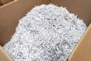 Paper recycle concept,white shredded paper documents to recycle in the cardboard box