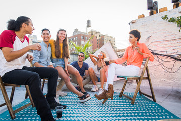 Group of friends having party on a rooftop
