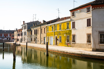 Fototapeta na wymiar canal and colorful houses in Comacchio, Italy