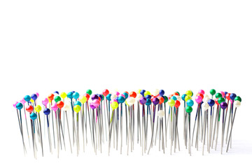 Sewing pins. Colorful sewing pins background. Close Up of sewing pins with multi colored heads. Part of set.