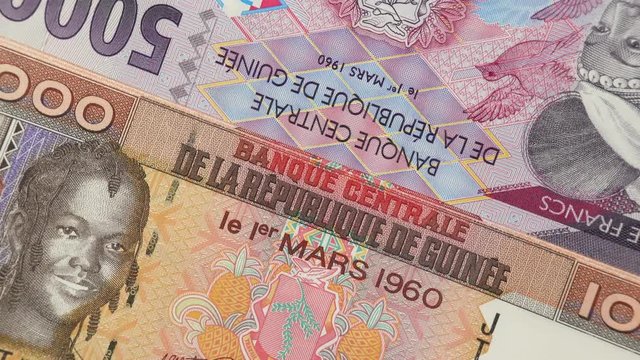 Guinea franc banknotes rotating.  Guinean currency, money. 4K stock video footage