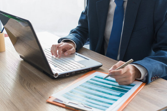 business man hands with computer on desktop