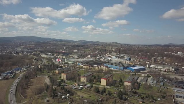 Gorlice, Poland - 3 9 2019: Industrial region of the Carpathian city. Top view of the refinery and auxiliary buildings. Video shot by drone or quadrocopter. Vanity of the day at the factory. Planning 