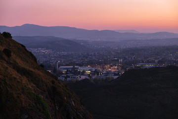 Night view of the city Edinburgh from Arthur Seat on background of the sunset sky, Edinburgh, Scotland, United Kingdom