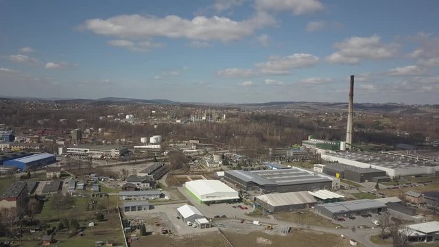 Gorlice, Poland - 3 9 2019: Industrial region of the Carpathian city. Top view of the refinery and auxiliary buildings. Video shot by drone or quadrocopter. Vanity of the day at the factory. Planning 