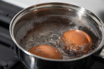 boiling eggs in a pan