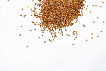 Buckwheat grain isolated on white background close up