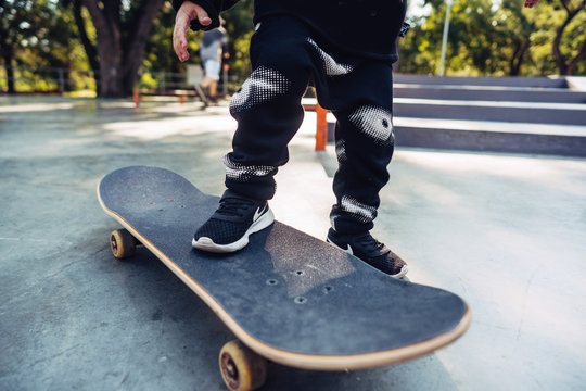 Boy legs on the skateboard close up image