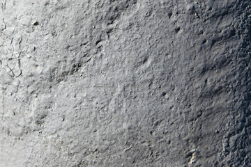 The texture of stone and paint is old