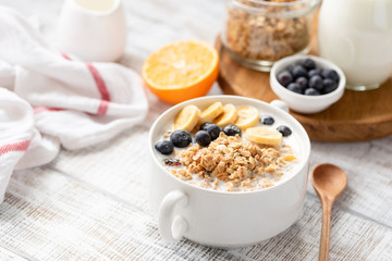 Healthy Breakfast Food Granola With Yogurt, Fruits In Bowl On White Wooden Table. Selective Focus