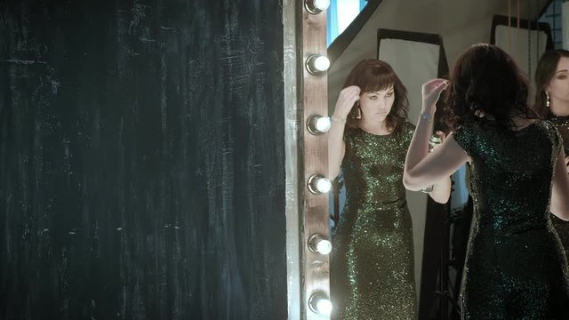 Actress in front of a mirror