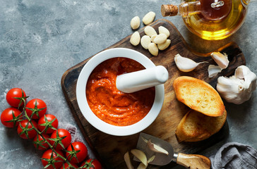 Romesco sauce, typical from Catalonia, Spain. Prepared with nora peppers, almonds, hazelnuts, garlic and tomato. - obrazy, fototapety, plakaty